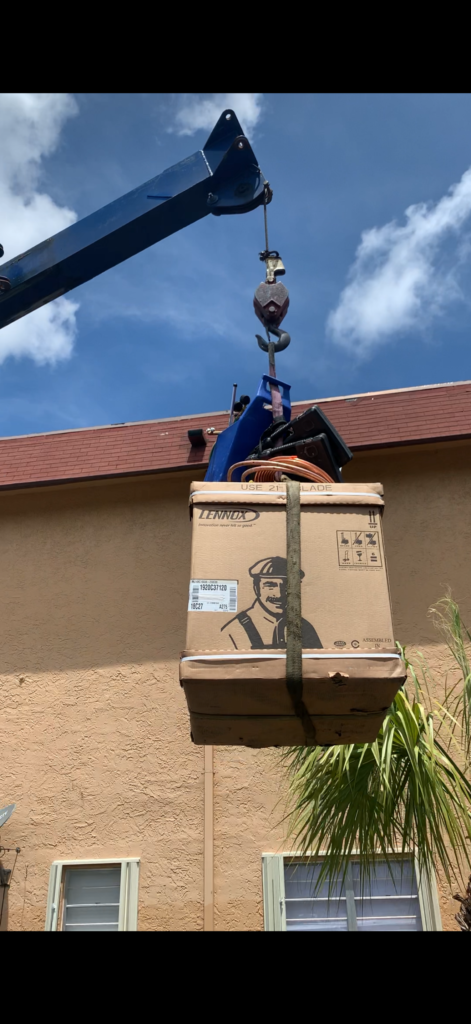 HVAC equipment lifted by crane